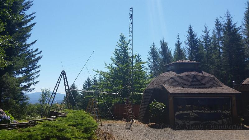 20150728_121758.jpg - Tower with rotator has been raised. Getting the antenna ready.