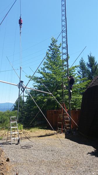 20150728_142857.jpg - Marc starting to climb up the tower.