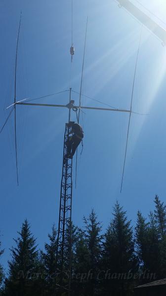 20150728_144818.jpg - Marc securing the antenna mast to the rotator.