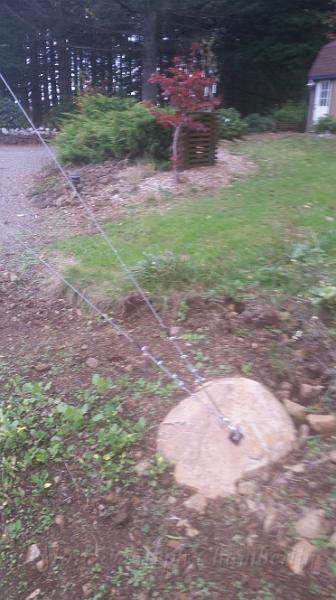 20161024_090941.jpg - Another guy wire anchored to another big bolder.