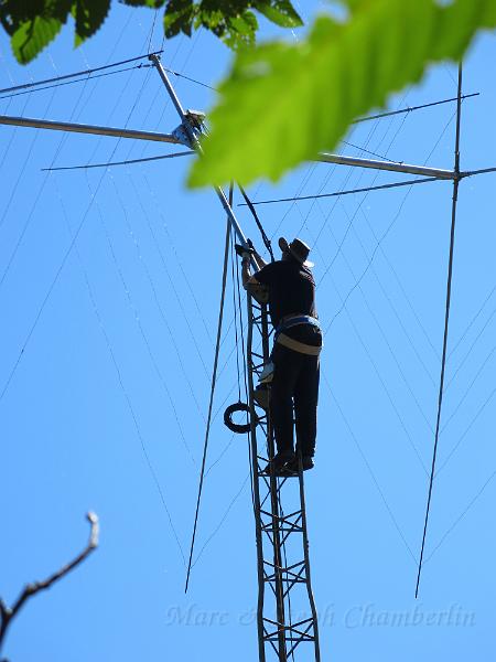 IMG_0662.JPG - Marc helping guide the antenna mast into the thrust bearing at the top of the tower.