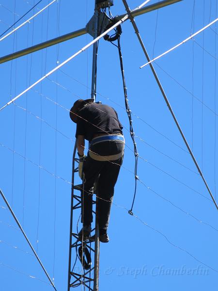 IMG_0665.JPG - Tightening up the rotator clamps to the mast.