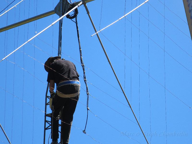 IMG_0664.JPG - Tightening up the rotator clamps to the mast.